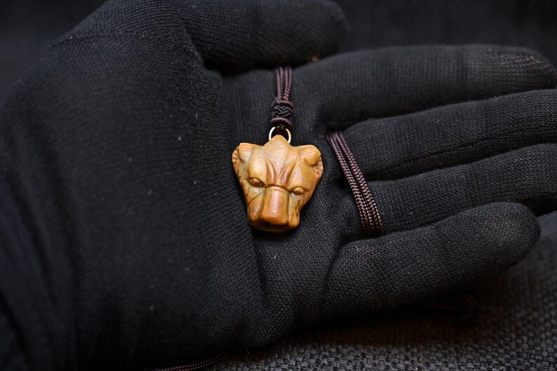 Handmade Sekhmet Lapis Pendant – Egyptian Goddess of War A Powerful Tribute to Sekhmet This Handmade Sekhmet Lapis Pendant brings together the deep blue beauty of lapis lazuli with the powerful symbolism of Sekhmet, one of ancient Egypt’s most formidable goddesses. Handmade as an Egyptian-inspired pendant, this piece celebrates a deity whose identity combined seemingly opposite forces. Sekhmet represented the destructive intensity of warfare and solar heat, yet she was also closely connected with healing, medicine, and royal protection. The natural blue character of the stone gives this Handmade Sekhmet Lapis Pendant a distinctive appearance, while the accompanying dark braided cord creates a simple presentation suitable for wearing as symbolic jewelry. For collectors interested in powerful female figures from Egyptian mythology, this amulet offers a striking connection with themes of courage, resilience, guardianship, and restoration. Product Features Product Name: Handmade Sekhmet Lapis Pendant Material: Lapis Lazuli Deity: Sekhmet Craftsmanship: Handmade Cord: Dark Braided Cord Primary Associations: War, Strength, Protection, Healing & Medicine Additional Association: Solar Power Style: Ancient Egyptian Inspired Type: Gemstone Pendant / Amulet Dimensions: Not Provided The Identity of Sekhmet Sekhmet was a major lioness goddess in ancient Egyptian religion. Her name is commonly translated as “The Powerful One,” perfectly expressing the strength and intensity associated with her divine character. She was most famously represented as a lioness-headed woman, sometimes shown with a solar disk that emphasized her relationship with the sun. Unlike deities defined by a single role, Sekhmet embodied multiple aspects of divine power. She could be: A fierce warrior A protector of kings A solar goddess A force associated with disease A deity connected with healing and medicine A guardian against hostile powers This combination makes the Handmade Sekhmet Lapis Pendant especially meaningful for people interested in symbols of strength balanced by restoration. The Lioness as a Symbol of Power Sekhmet’s lioness form was essential to her identity. The lioness represented qualities that ancient Egyptians could associate with divine force: Strength • Speed • Ferocity • Vigilance • Protection Her image communicated the idea of a goddess capable of overwhelming enemies while defending those under her protection. For modern jewelry enthusiasts, wearing a Handmade Sekhmet Lapis Pendant can evoke personal qualities such as: Courage • Confidence • Determination • Resilience Defender of Royal Power Sekhmet possessed a strong connection with Egyptian kingship. Her fierce nature could be directed toward defending the pharaoh and defeating hostile forces. Ancient royal ideology often used powerful divine imagery to communicate the king’s ability to maintain order and overcome threats. Sekhmet’s lioness power made her particularly suitable for this protective role. Her symbolism extends beyond destruction to represent defensive strength and stability. A Goddess of War and Solar Energy Sekhmet was strongly associated with warfare and battle. Her aggressive force represented the power needed to defeat enemies, while her solar character connected her with the burning heat of the Egyptian sun. In ancient religious thought, destructive power could become necessary when directed against forces threatening divine or royal order. The Unexpected Goddess of Healing Sekhmet’s connection with healing is one of the most fascinating features of her identity. The same goddess who represented disease and destructive power was also associated with medicine and recovery. Her priests had connections with healing practices, and Sekhmet was invoked in contexts involving health and illness. Her divine nature united contrasting concepts: Illness and Recovery Destruction and Restoration Danger and Protection War and Healing This duality adds deep significance to the Handmade Sekhmet Lapis Pendant. Sekhmet and the Sun Sekhmet was strongly connected with solar power and the Eye of Ra, representing the active and protective force of solar divinity. For modern symbolic interpretation, her solar aspect represents: Energy • Vitality • Strength • Determination The Destruction of Mankind Tradition One of the best-known stories connected with Sekhmet concerns the punishment of rebellious humanity, where she was sent as the Eye of Ra. When her destructive campaign became too intense, the gods pacified her with red-dyed beer, ending the violence. This story illustrates an essential Egyptian concept: uncontrolled force must ultimately return to balance. Sekhmet and Hathor Sekhmet and Hathor shared certain solar traditions involving the Eye of Ra, yet maintained distinct roles. Sekhmet focused on war, fierce protection, healing, and solar force, whereas Hathor embodied love, joy, music, and motherhood. Sekhmet in Memphis Sekhmet was central to the religious traditions of Memphis, forming a divine family alongside Ptah and Nefertum: Ptah – Sekhmet – Nefertum Her place within this triads highlights her significance beyond warfare alone. The Beauty of Lapis Lazuli This Handmade Sekhmet Lapis Pendant is carved from natural lapis lazuli, a stone highly prized in ancient Egyptian luxury objects, amulets, and inlays. Natural lapis lazuli displays individual variations in blue intensity, veining, and mineral inclusions, ensuring each pendant possesses a unique character. Dark Braided Cord A dark braided cord accompanies the pendant, creating an understated contrast with the blue gemstone while keeping the carved amulet as the central focal point. A Distinctive Gift The Handmade Sekhmet Lapis Pendant makes an excellent gift for: Sekhmet and mythology collectors Egyptology enthusiasts Lapis lazuli jewelry lovers Historical art enthusiasts Unique cultural gift buyers Shipping Information Orders are shipped directly from Egypt and carefully packaged for transportation: Tracking Info: Provided after dispatch. Phone Number Required: A reachable phone number is required for international delivery. Safe Delivery: Securely packaged to ensure safe arrival. Product Specifications Product: Handmade Sekhmet Lapis Pendant Focus Keyword: Handmade Sekhmet Lapis Pendant Material: Lapis Lazuli Deity: Sekhmet Craftsmanship: Handmade in Egypt Cord: Dark Braided Cord Main Associations: War, Protection, Healing, Medicine & Solar Power Style: Ancient Egyptian Inspired Handmade Sekhmet Lapis Pendant